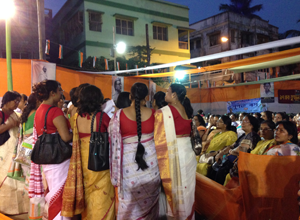 Rabindra Sangeet at a karmi sabha in Tollygunge. In the backdrop are photographs of Gandhiji and Netaji.